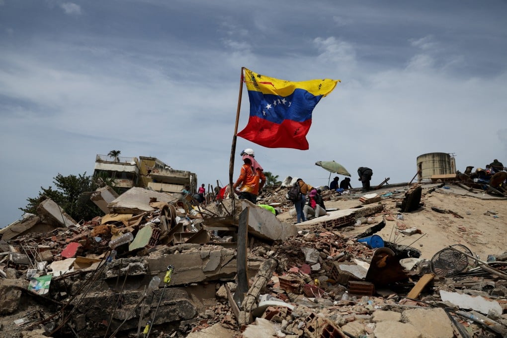 Rescuers search the rubble of a collapsed building on Sunday. Photo: Reuters
