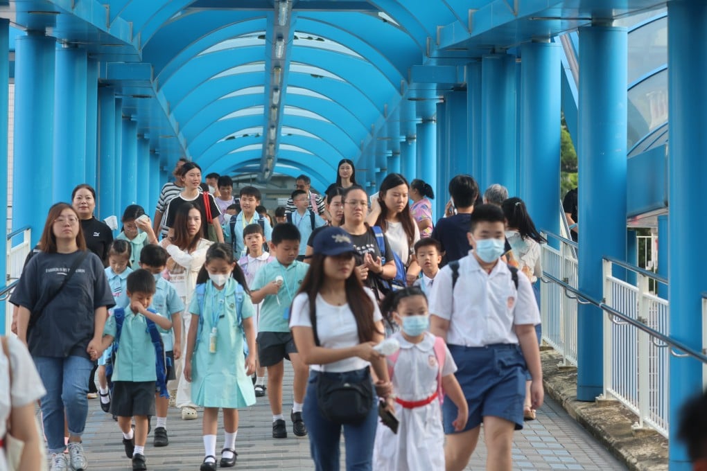 Primary school students on the way to class. The central allocation stage uses a computer-based system that takes account of academic banding and school nets. Photo: Edmond So