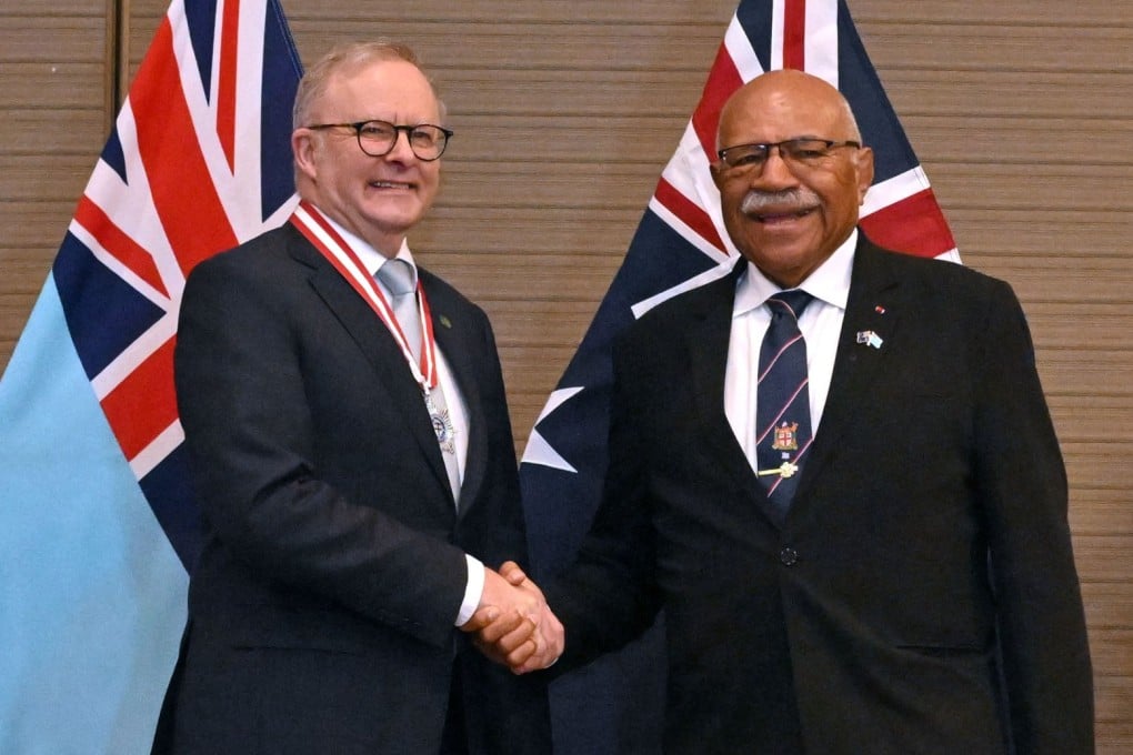 Prime ministers of Australia, Anthony Albanese (left), and Fiji, Sitiveni Rabuka, shake hands after signing a treaty in Suva on Monday. Photo: EPA