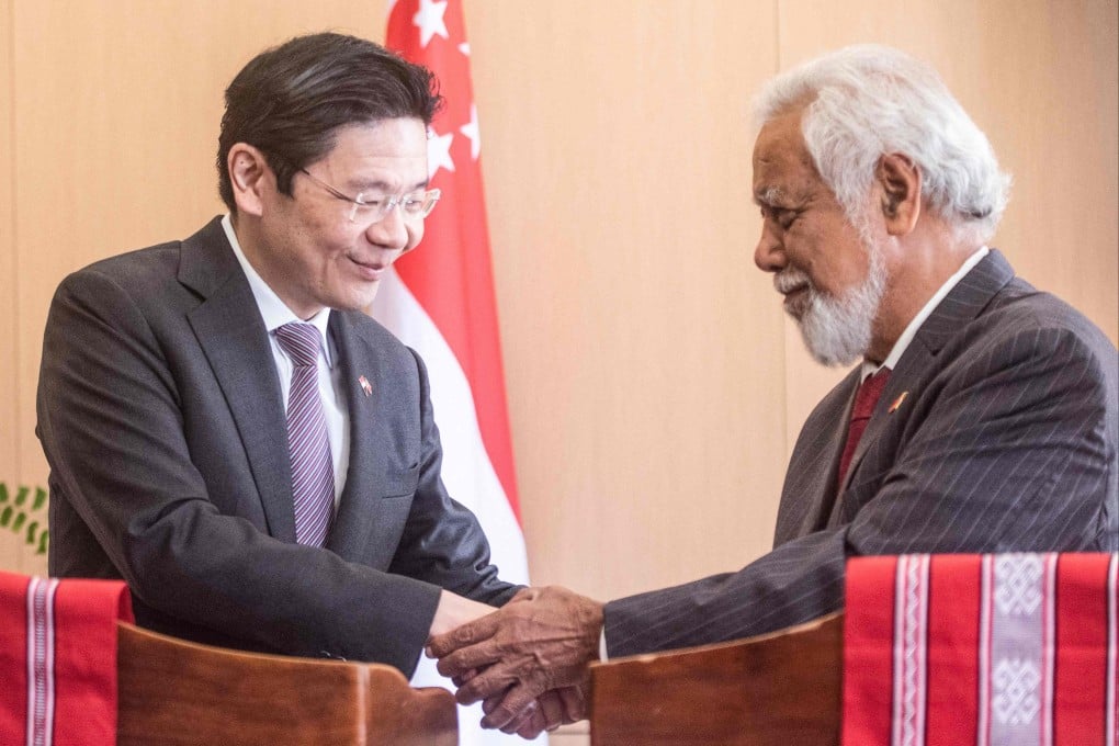 Singapore’s Prime Minister Lawrence Wong (left) and his East Timorese counterpart Xanana Gusmao shake hands at the Government Palace in Dili on Friday. Photo: AFP