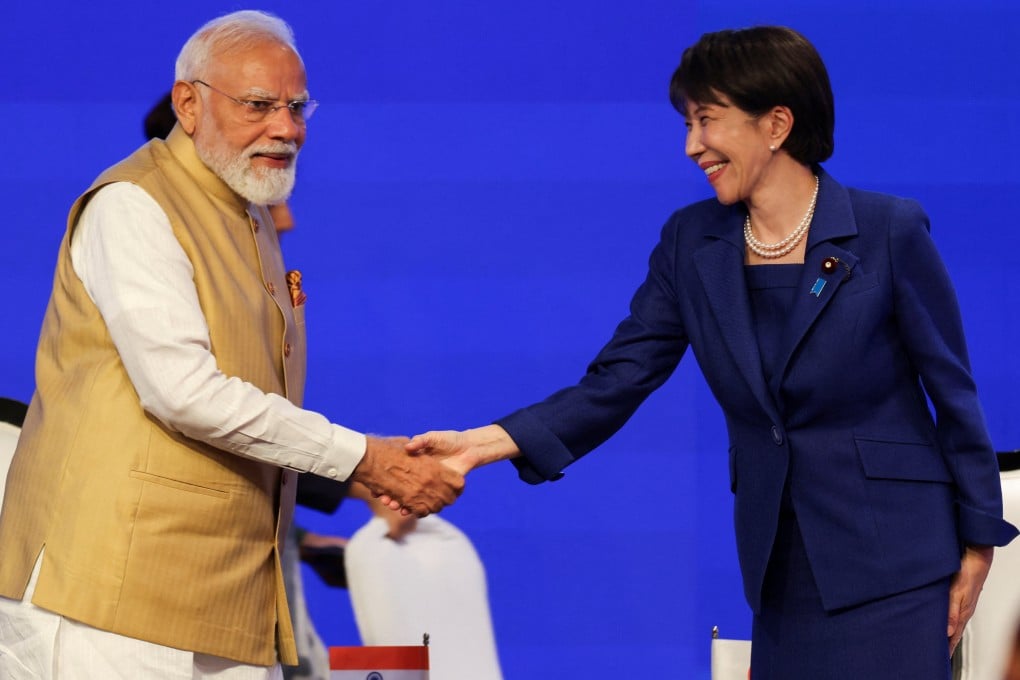 Indian Prime Minister Narendra Modi shakes hands with his Japanese counterpart Sanae Takaichi at an economic forum in New Delhi on Thursday. Photo: Reuters.