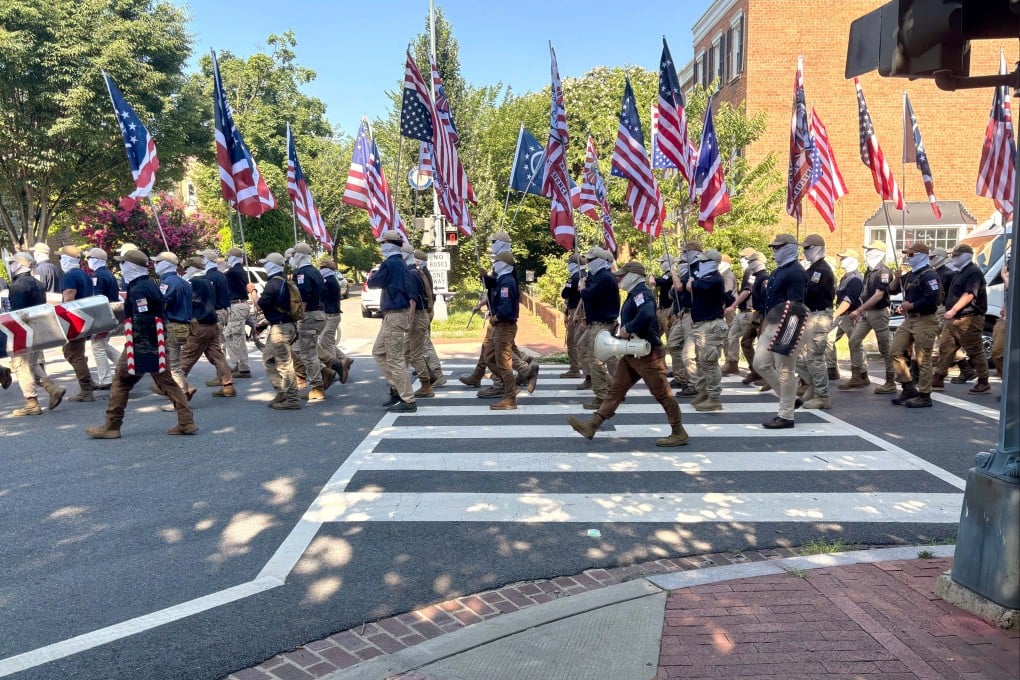 Members of the group Patriot Front march through Washington. Photo: Mark Sherman via AP