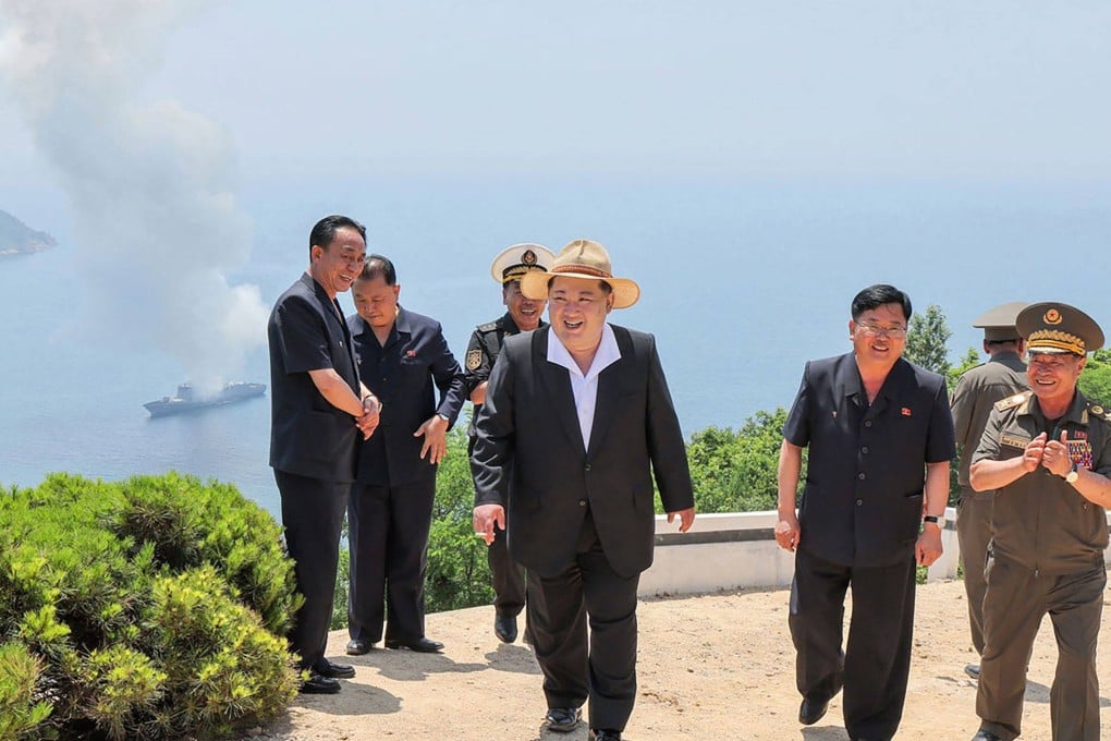 North Korean leader Kim Jong-un reacts after overseeing a performance test of the main weapons systems of the destroyer Kang Kon at an undisclosed location in North Korea on Friday. Photo: KCNA/KNS/AFP