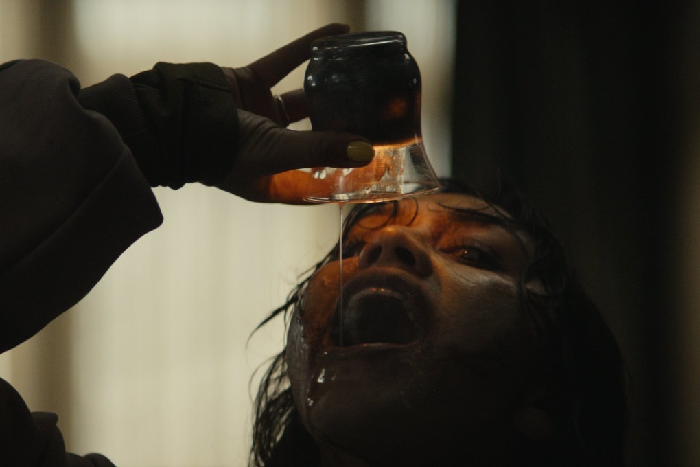 Luciane Buchanan in a still from Evil Dead Burn, directed by Sebastien Vanicek.