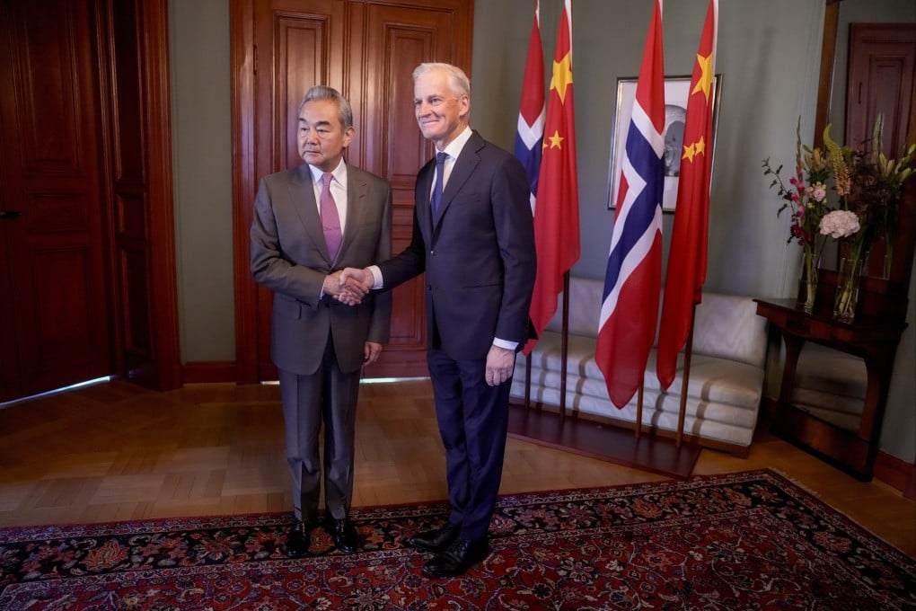 China’s Foreign Minister Wang Yi, left, with Norwegian Prime Minister Jonas Gahr Stoere at the prime minister’s residence in Oslo, Norway on Monday. Photo: EPA