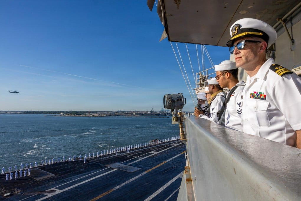 Sailors on the flight deck of the world’s largest aircraft carrier, the USS Gerald R. Ford, in May. A fire broke out in the warship’s laundry room in March. Photo: Handout