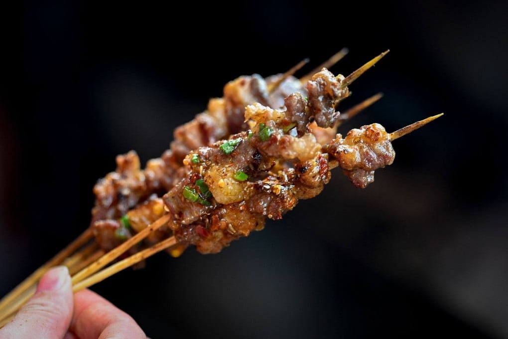 A trainee makes barbecue skewers at Yueyang Barbecue Academy in Yueyang, in China’s Hunan province. With China’s economy slowing and well-paying jobs in traditional sectors harder to come by, interest in joining the academy is high. Photo: AFP