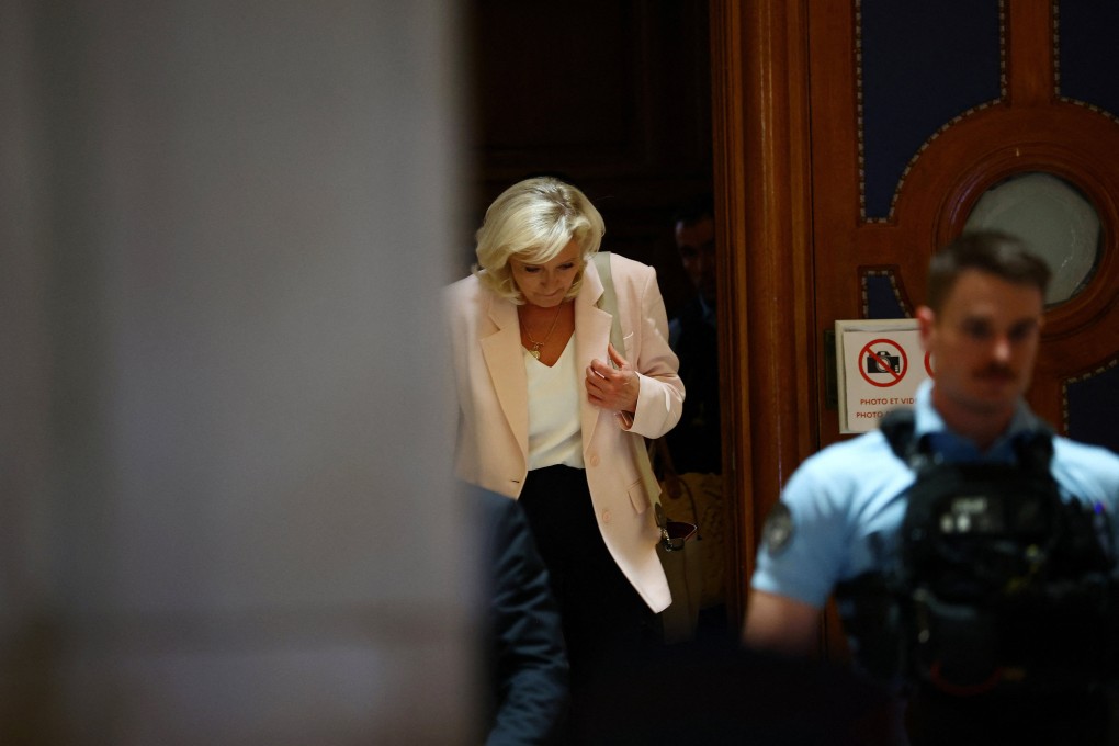 French far-right leader Marine Le Pen leaves after the verdict in her appeal trial at the Paris courthouse on the Ile de la Cite on Tuesday. Photo: Reuters