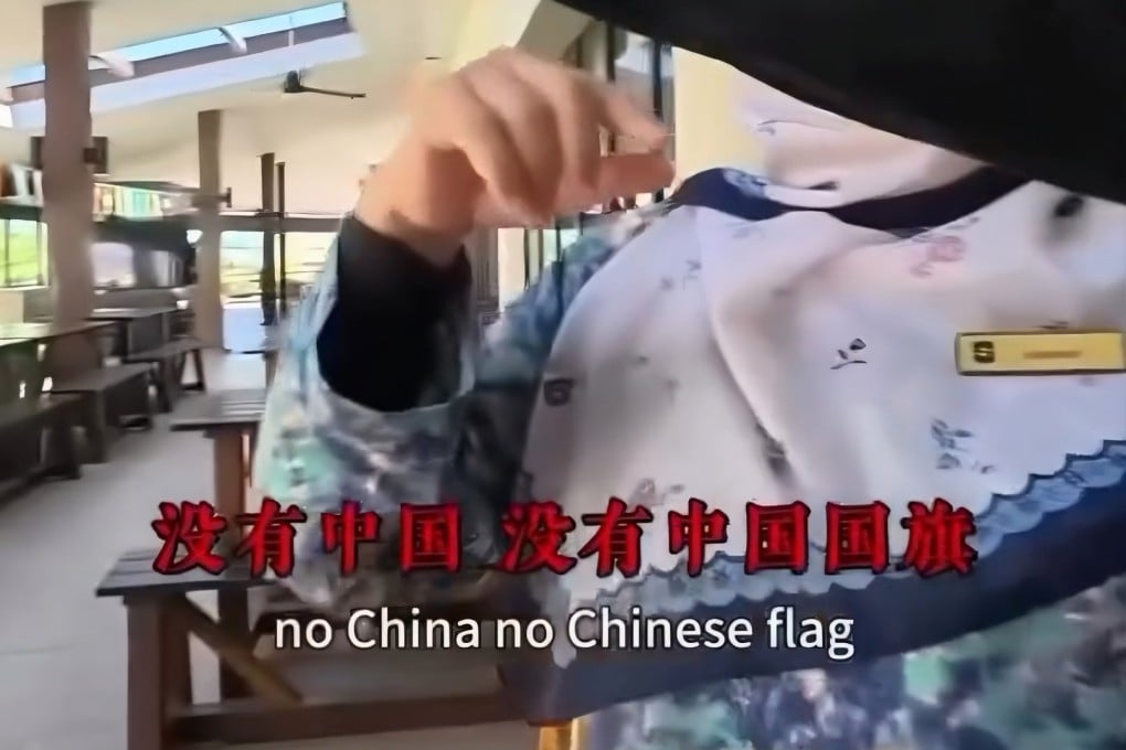 A still from a social media video showing a Chinese tourist interrogating a hotel worker in Kuala Lumpur about the absence of China’s national flag from a World Cup display. Photo: Threads