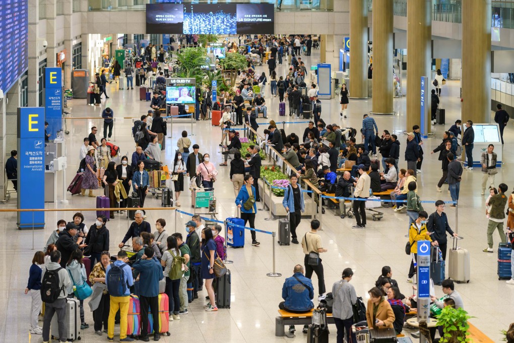 Passengers pass through Incheon International Airport in April 2024. Photo: Getty Images