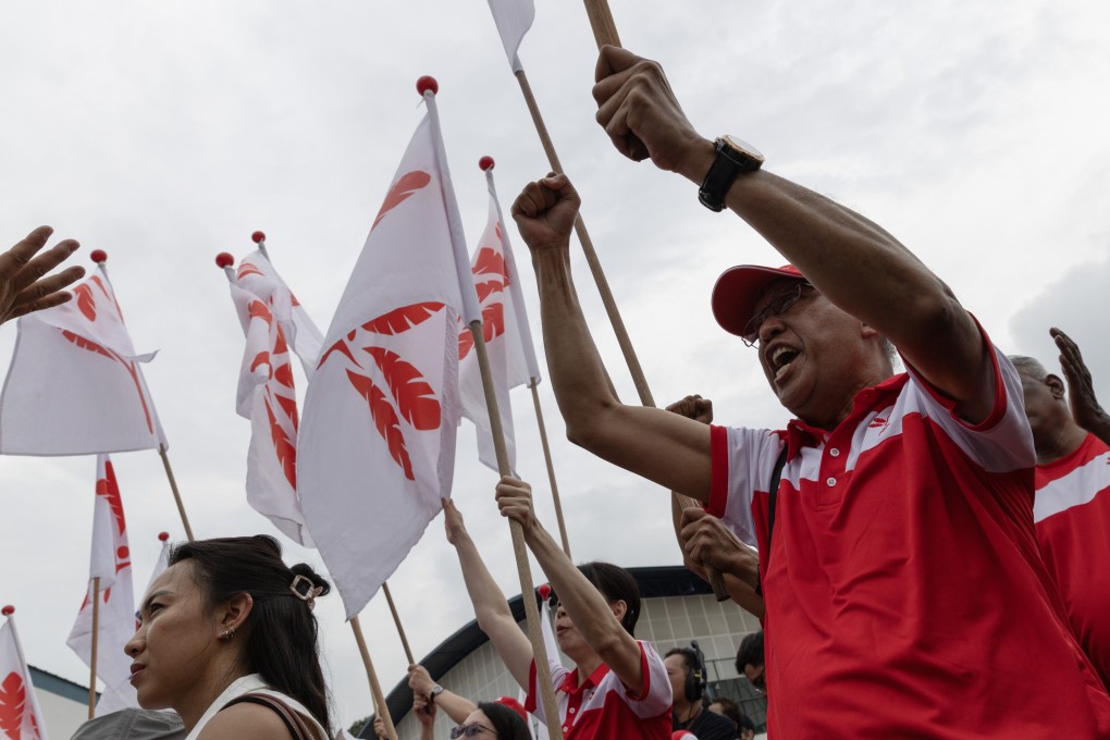 Progress Singapore Party supporters wave flags at a nomination centre on Apriil 23, 2025. Photo: EPA-EFE