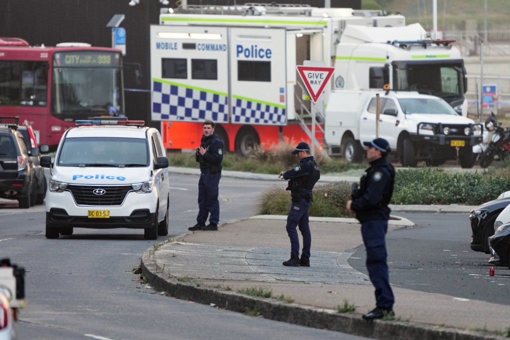 Police patrol in the early morning of December 15 at Sydney’s Bondi Beach following the previous day’s shooting. Photo: AP