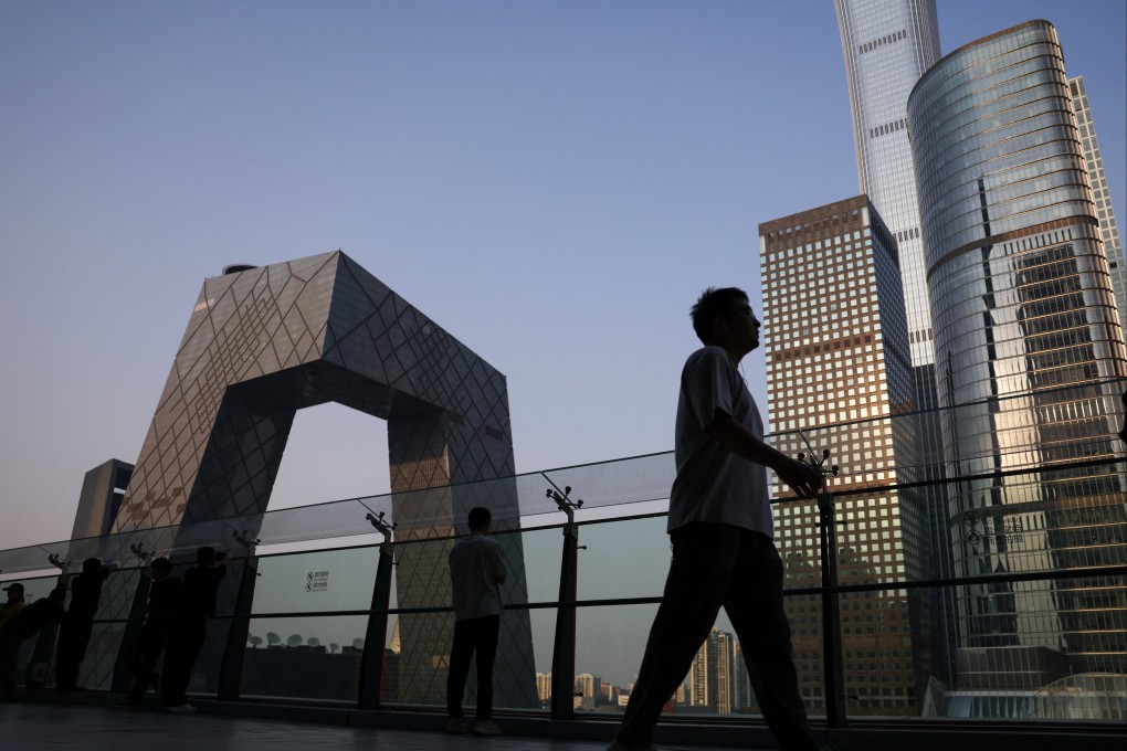 People are seen on the terrace of a shopping mall overlooking the central business district in Beijing. China was the world’s third-largest source of foreign direct investment in 2025. Photo: Reuters