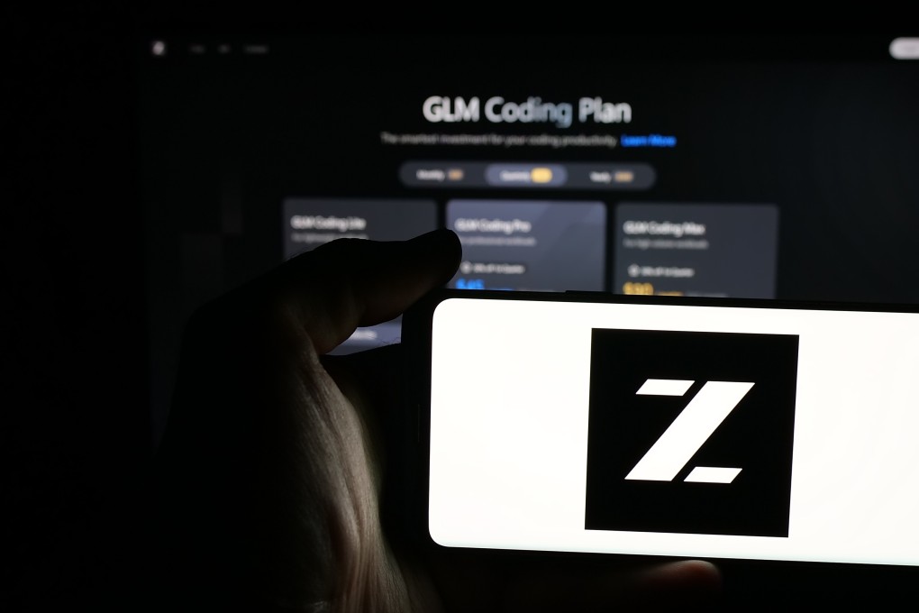 Person holding mobile phone with logo of Zhipu Huazhang Technology on screen in front of web page. The company recently marked a breakthrough with its GLM-5.2 model. Photo: Shutterstock Images