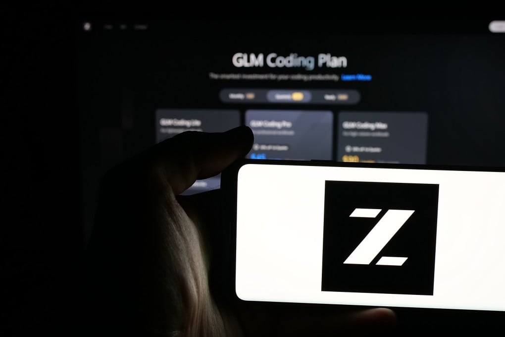 Person holding mobile phone with logo of Zhipu Huazhang Technology on screen in front of web page. The company recently marked a breakthrough with its GLM-5.2 model. Photo: Shutterstock Images