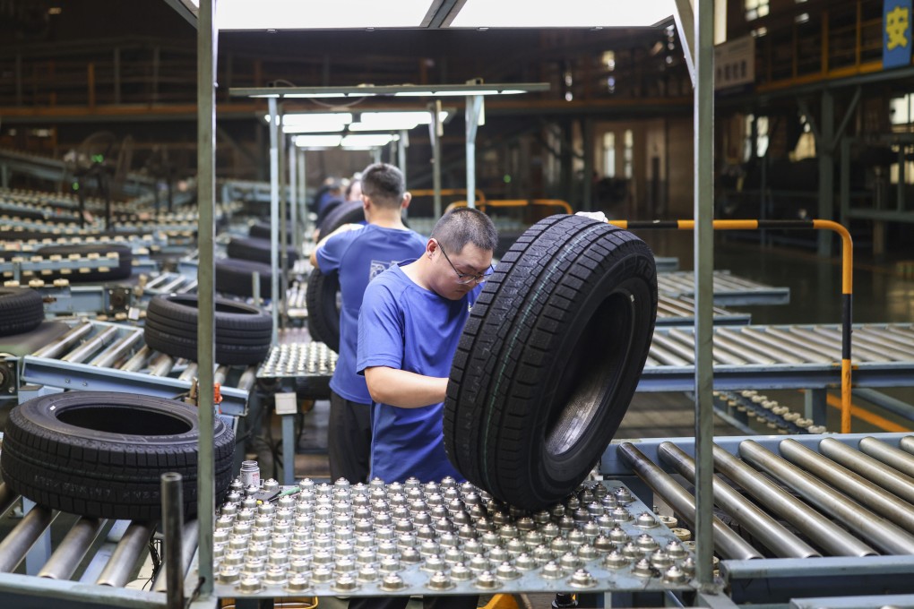 Employees at a rubber tyre manufacturing facility in Dongying in China’s eastern Shandong province on June 20. Photo: VCG via Getty Images