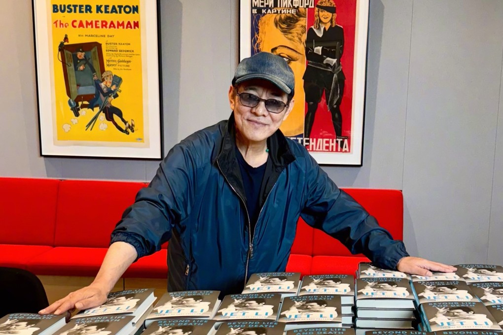 Jet Li stands with copies of his new book “Beyond Life and Death: The Way of True Freedom”, which details the martial arts movie star’s search for himself through Tibetan Buddhism and reveals things about his life many fans probably weren’t aware of.