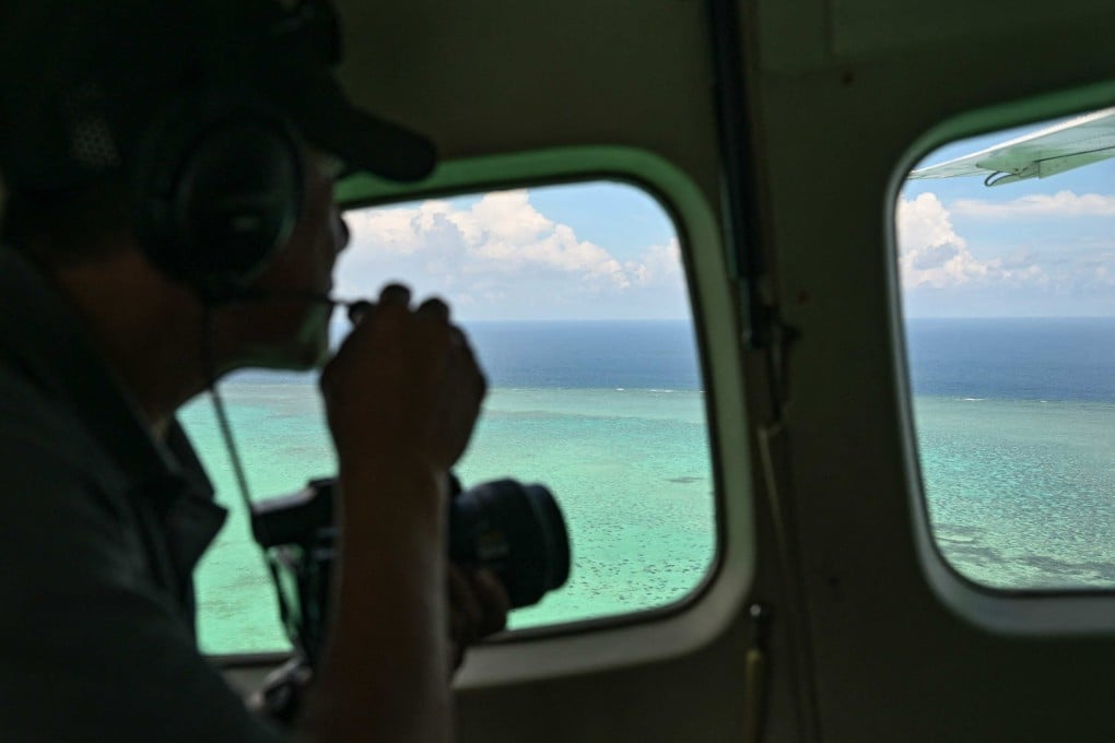 A Philippine coastguard personnel monitors Scarborough Shoal in the disputed South China Sea on June 15. Photo: AFP