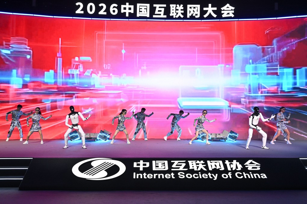Robot and human performers on stage before the China Internet Conference’s opening ceremony in Beijing on Wednesday. Photo: Xinhua