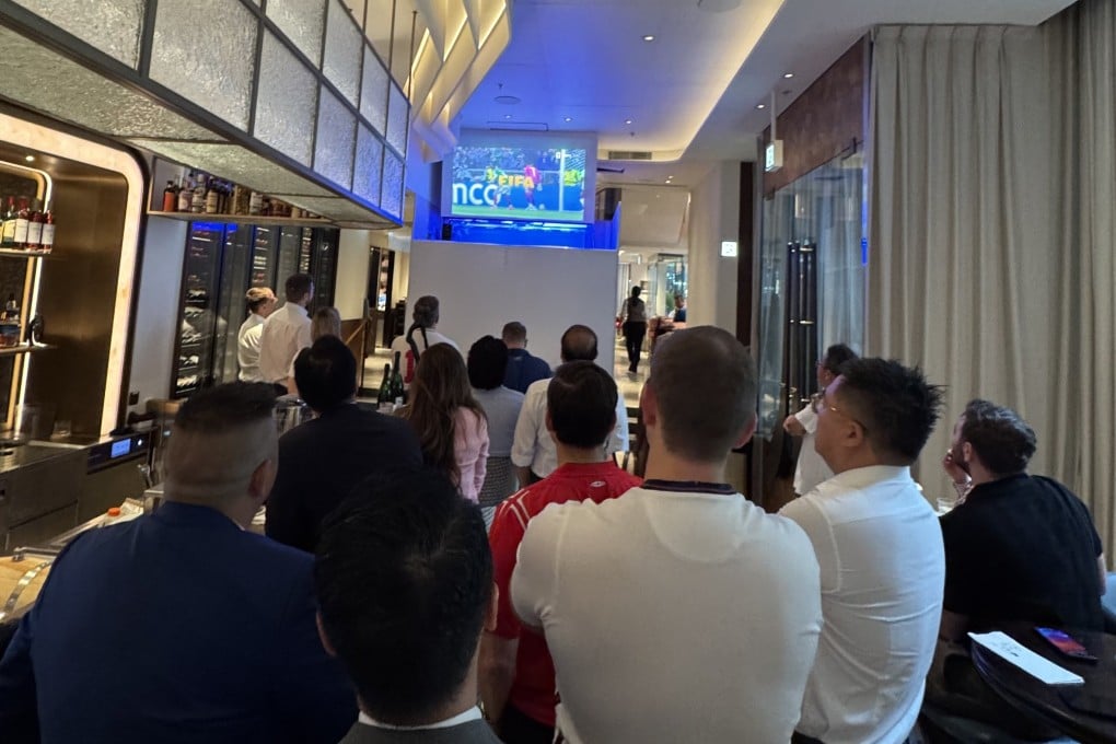 Fans watch England’s World Cup match against Mexico inside Dot Cod in Hong Kong’s Central district on an early Monday morning in July 2026. Photo: Veronica Qi