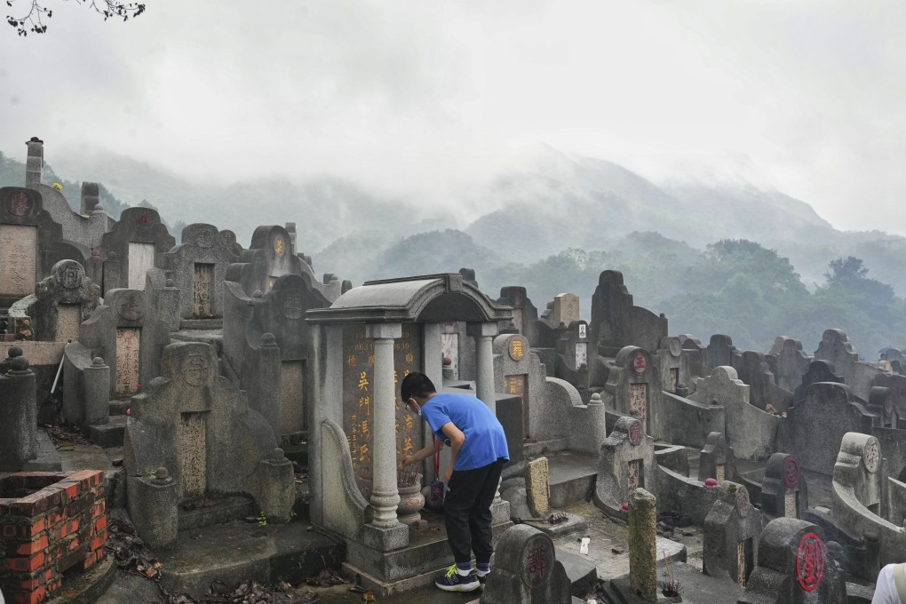 A boy offers incense before an ancestral grave on Diamond Hill in Hong Kong on Ching Ming Festival on April 5, 2023. The festival is a time of remembrance across the Chinese diaspora. Photo: Elson Li