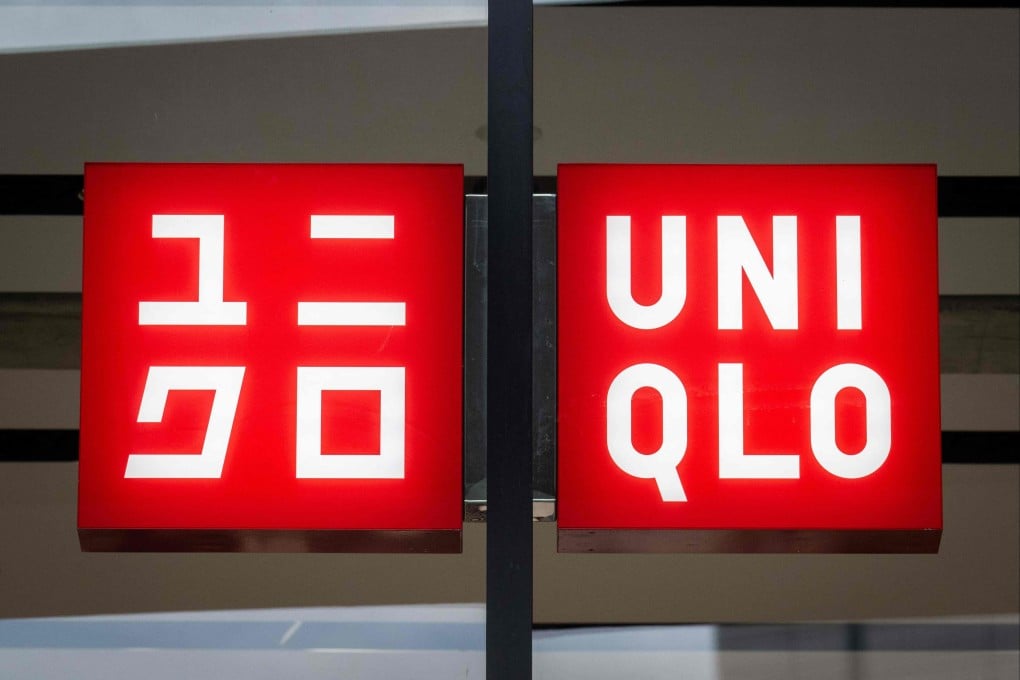 The logo of the Fast Retailing clothing brand Uniqlo outside a branch in Tokyo. Photo: AFP