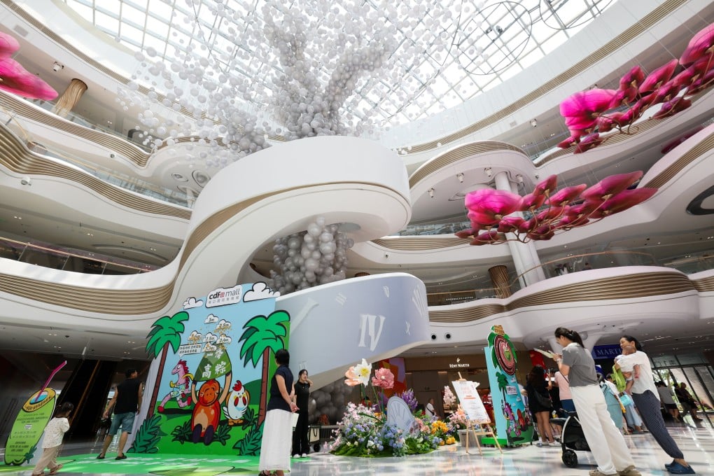 People are seen at the massive Haikou International Duty Free Shopping Complex in China’s Hainan province. Photo: Xinhua
