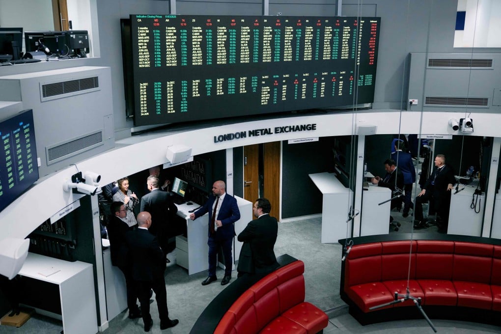 Traders, brokers and clerks gesture on the trading floor of the open outcry pit, also known as The Ring, at the London Metal Exchange Ltd (LME), on March 11, 2025. Photo: AFP