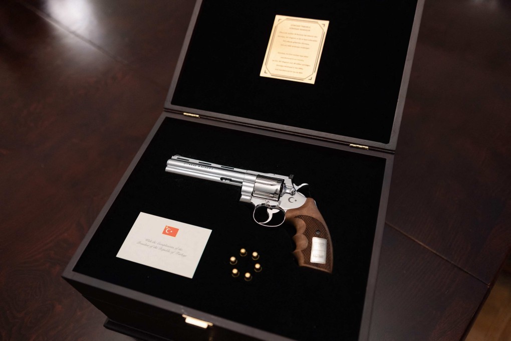 A revolver given to Lithuanian President Gitanas Nauseda, with the president’s name engraved on it, is displayed during a press presentation in Vilnius, Lithuania. Photo: Office of the Lithuanian President via AFP