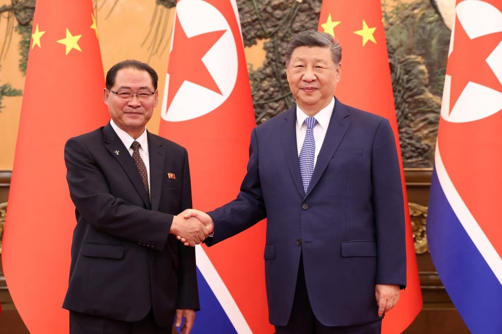Chinese President Xi Jinping (right) and North Korean Premier Pak Thae-song meet in Beijing on Friday. Photo: Reuters
