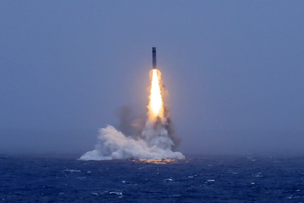 A long-range ballistic missile bursts out of the sea during a test launched from a Chinese nuclear-powered submarine in the South Pacific on Monday. Photo: Xinhua/AP