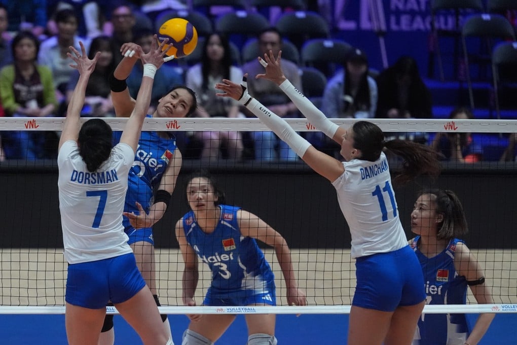 China’s Zhuang Yushan tries to get through the Ukraine defence in their Women’s Volleyball National League Hong Kong match at Kai Tak Arena on Thursday. Photo: Elson Li