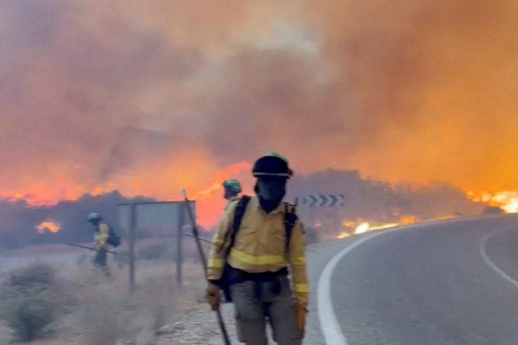 Emergency personnel work during a wildfire in Almeria, Spain, in this screengrab taken from a handout video released on Friday. Photo: Handout via Reuters