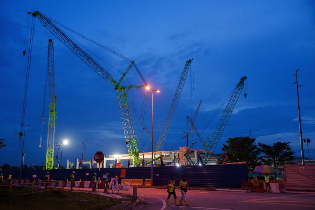 Workers walk outside a data centre building under construction in Johor Bahru Malaysia, on September 28, 2024. Photo: AP