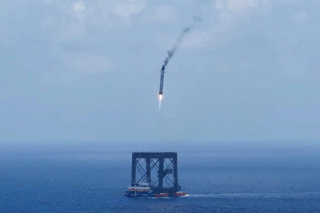 A drone photo shows the capturing of the returned first stage of the Long March-10B carrier rocket on a seaborne platform via a net-capture system, near Wenchang in southern China’s Hainan province on July 10. Photo: Xinhua via AP