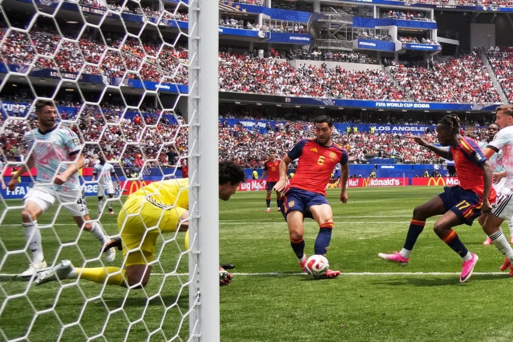 Mikel Merino (middle) places home his winning goal for Spain past replacement Belgian goalkeeper Senne Lammens. Photo: Reuters