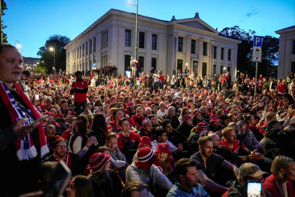 Norwegian supporters celebrate their round-of-16 win over Brazil at Karl Johans gate in Oslo on Sunday. Photo: AFP