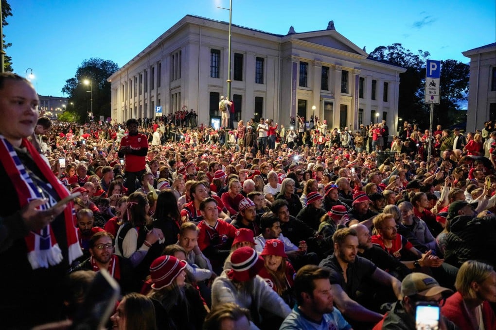 Norwegian supporters celebrate their round-of-16 win over Brazil at Karl Johans gate in Oslo on Sunday. Photo: AFP