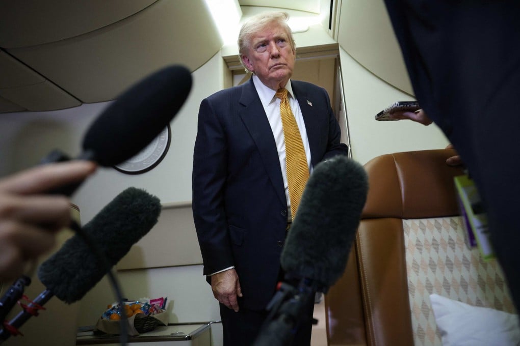 US President Donald Trump speaks to members of the press for the first time aboard the new Air Force One while in flight from RAF Mildenhall AFB to Joint Base Andrews on Wednesday. Photo:   AFP