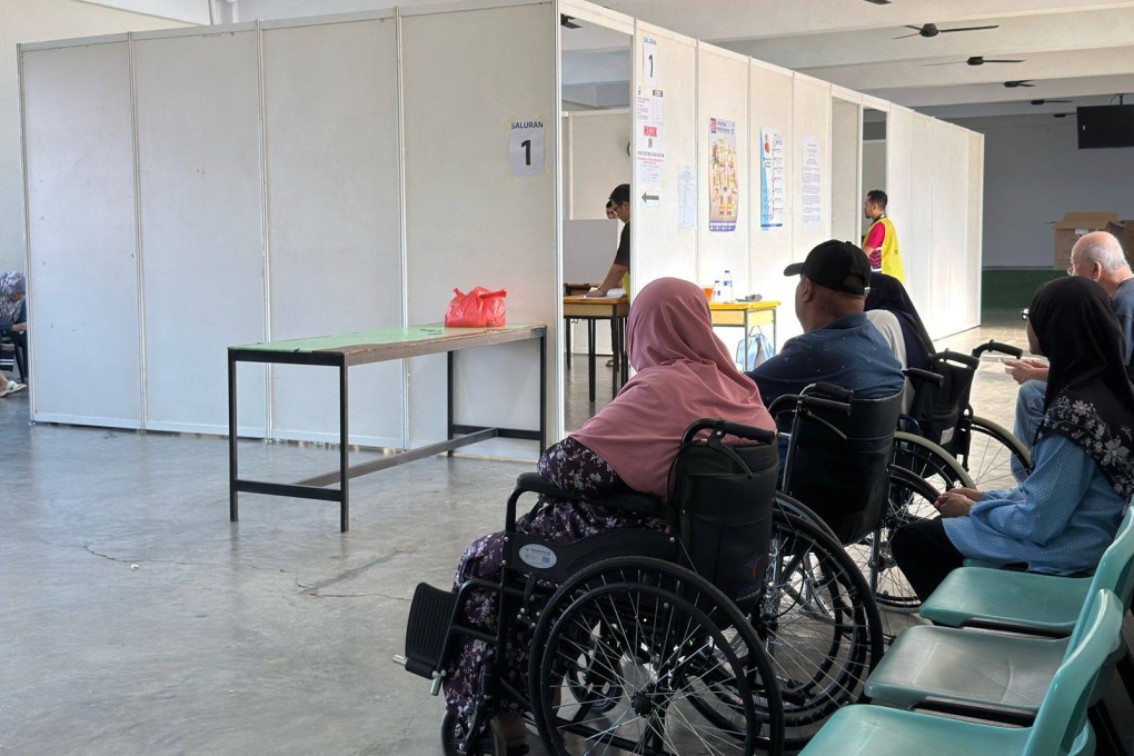 Voters wait to cast their ballots inside a polling centre in Puteri Wangsa, Johor, on Saturday. Photo: Iman Muttaqin Yusof