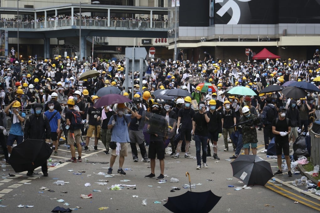 Protesters gather near the government headquarters in Admiralty during demonstrations against the extradition bill on June 12, 2019. Photo: James Wendlinger