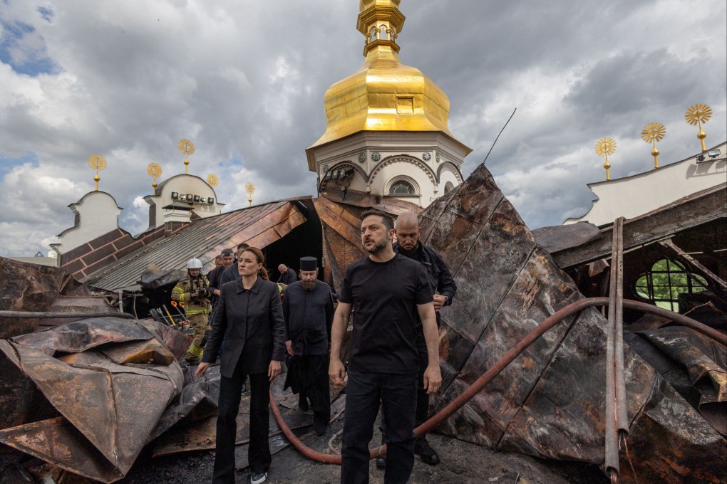Ukrainian President Volodymyr Zelensky and Prime Minister Yulia Svyrydenko visit the Dormition Cathedral of the Kyiv Pechersk Lavra, which was hit during Russian strike in June. Photo: Ukrainian Presidential Press Service via Reuters