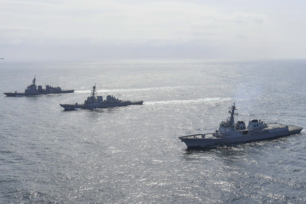 South Korean and Japanese navy ships sail in waters off South Korea’s east coast during a joint exercise in April 2023. Photo: EPA-EFE