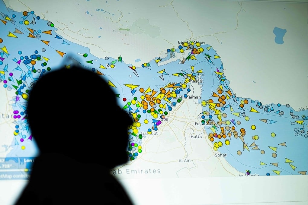 A person stands in front of a large screen displaying vessel movements in the Strait of Hormuz on a ship-tracking website in Nicosia, Cyrpus, on May 4. Iran announced it was closing the Strait of Hormuz on July 12 and launched missiles and drones at its Gulf neighbours, in retaliation for new US strikes following an attack by Iranian forces on a merchant vessel that was abandoned in flames by its crew. Photo: AFP