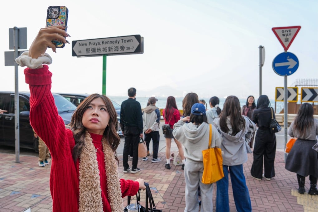 Tourists gather at a photo hotspot in Kennedy Town. No government anywhere has commissioned an official bilingual typeface for traditional Chinese and Latin scripts. Hong Kong is well placed to attempt one. Photo: Sam Tsang