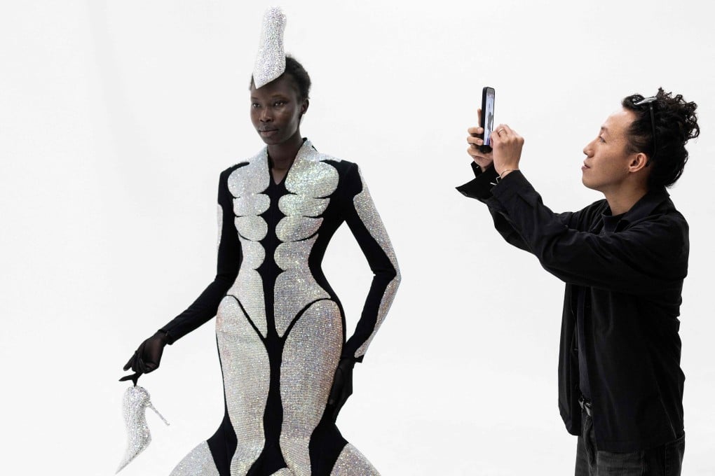Hong Kong-born and London-based fashion designer Robert Wun with a model wearing one of his creations in Paris on July 7, 2026. Photo: AFP