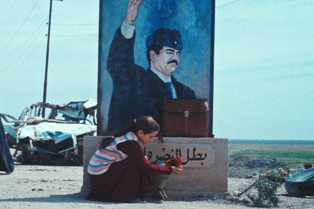 Baneen Ahmad Nayyef (kneeling) in a still from The President’s Cake (category IIA, Arabic), directed by Hasan Hadi. Waheed Thabet Khreibat and Sajad Mohamad Qasem co-star.