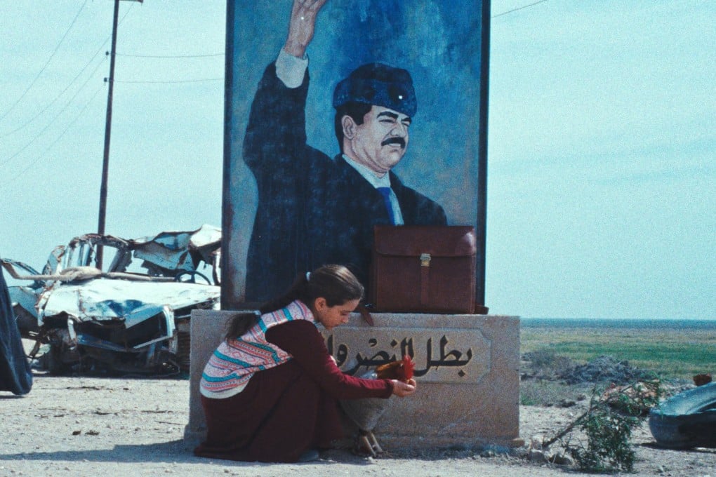 Baneen Ahmad Nayyef (kneeling) in a still from The President’s Cake (category IIA, Arabic), directed by Hasan Hadi. Waheed Thabet Khreibat and Sajad Mohamad Qasem co-star.