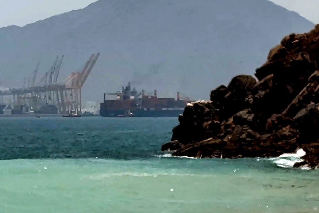 A ship sails near the Strait of Hormuz off the eastern coast of the United Arab Emirates at Khor Fakkan on Sunday. Photo: AFPTV
