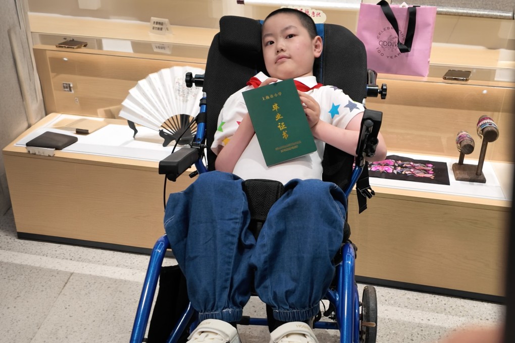Zou Weiluo, 12, with spinal muscular atrophy - once given under three years to live - inspires millions by graduating primary school. Photo: The Paper